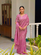 Woman wearing a pink saree with a white background